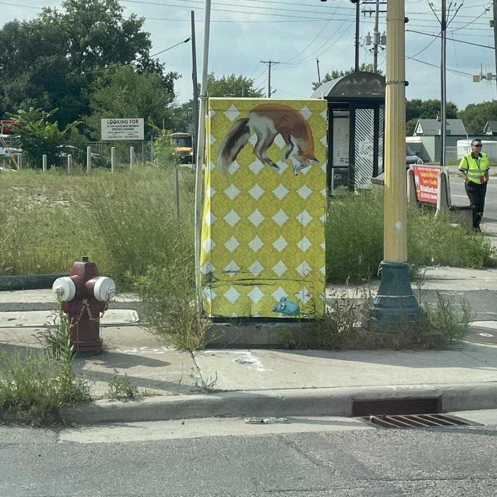 Photos of utility boxes, one with graffiti and then the same box after cleaning